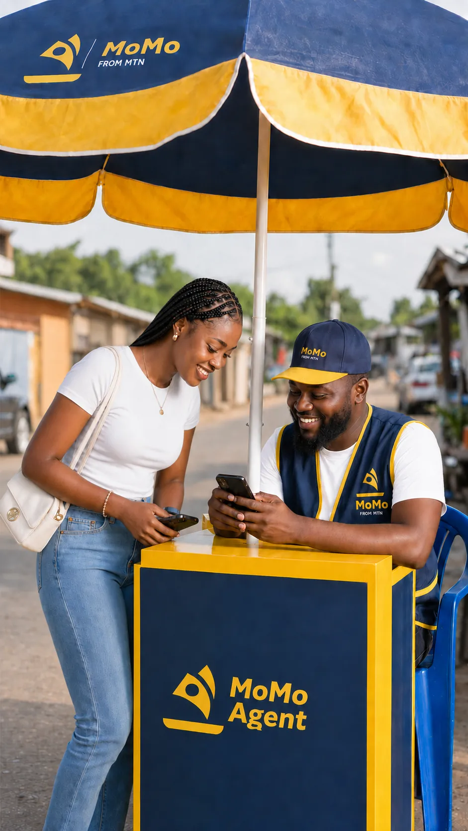 MTN MoMo Agent at an umbrella stand with a customer